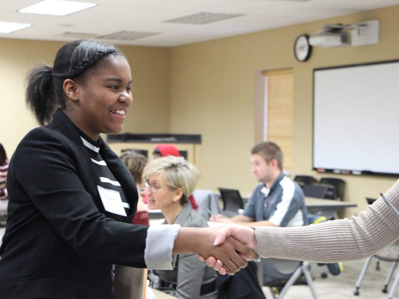A student participates in a mock interview during TeenQuest's job preparedness program.