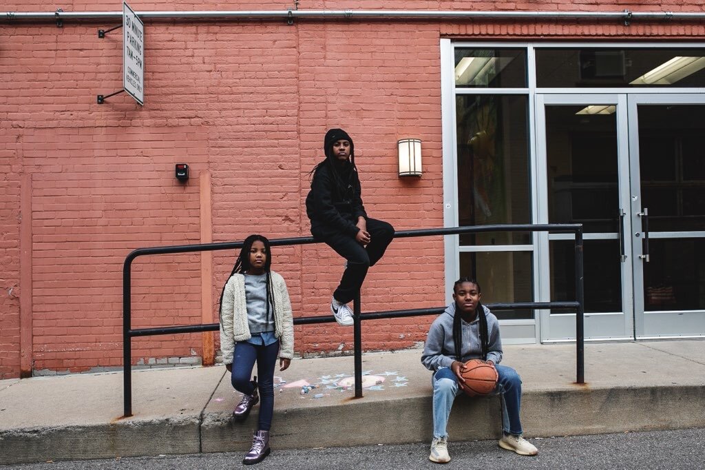 Flint youth pose in Buckham Alley of downtown Flint during a shoot for BAU-HOUSE's ‘The Youth Will Lead US’ campaign.