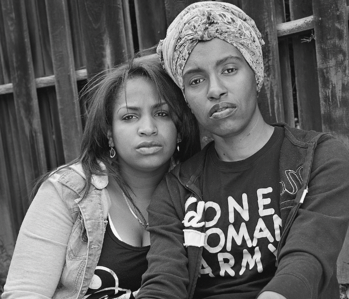 Flint natives Shea Cobb (left) and Amber Hasan (right) photographed together as a part of the 'Flint Is Family In Three Acts' exhibition.