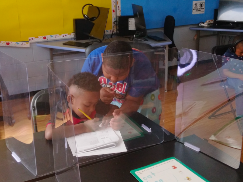 Students work on an assignment together during a Math4Flint class at the Flint Development Center located at 4121 Martin Luther King Avenue in Flint, MI.