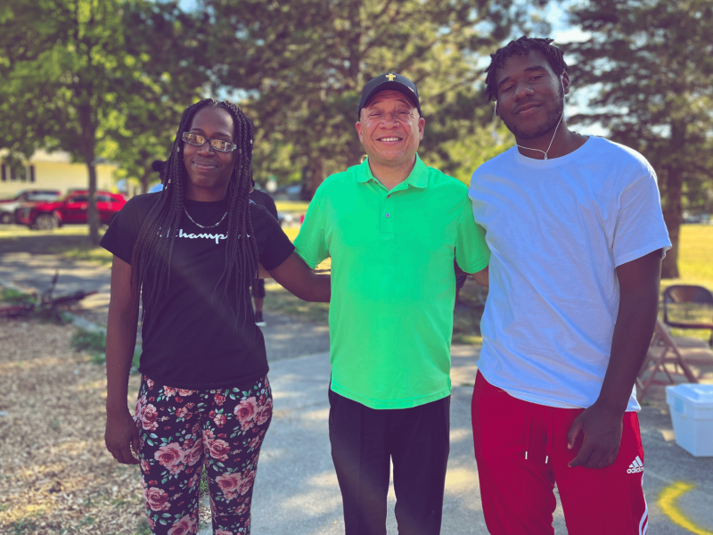 Hamady High School graduate Kealen Gilbert poses with his mother and Flint Mayor Sheldon Neely at Sarvis Park's Open House