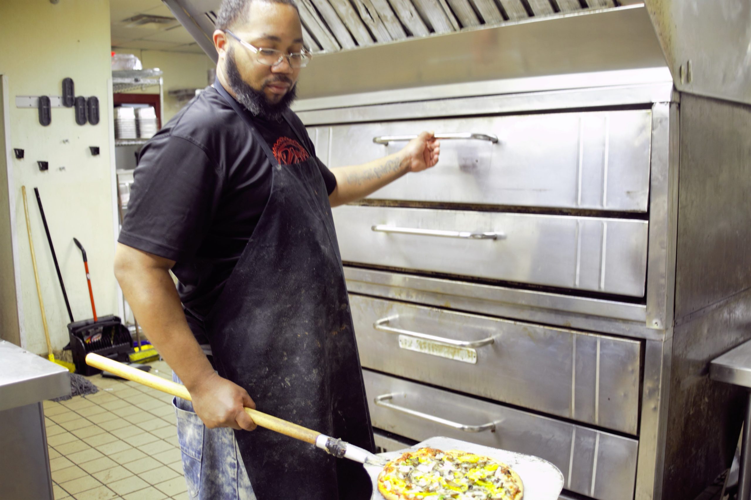 “We can’t keep up. We have a combo with brisket and ribs, so [customers] get that family pack!” - Pizza chef Anthony Holmes 