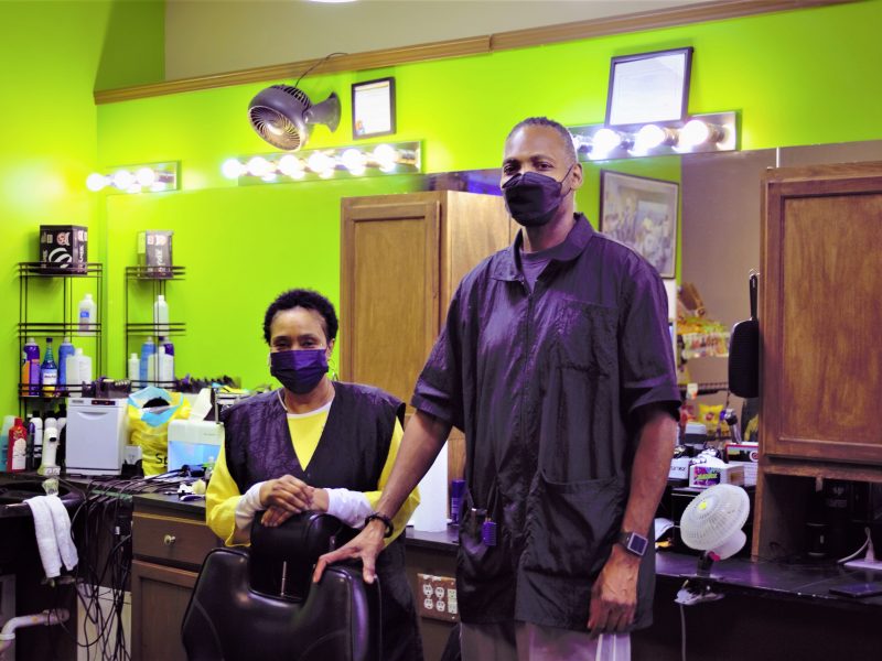 Flint barber Rene Dickson and owner Maurice Dantzler inside Big Daddy's Barber Shop.