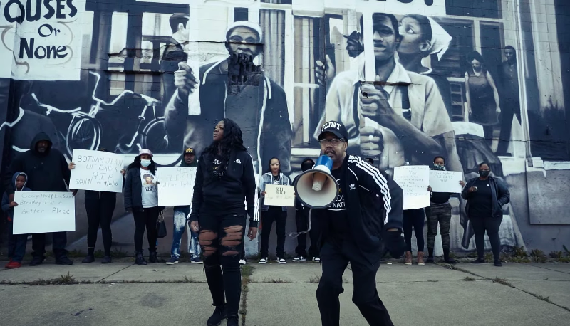 Flint native Coach Keith Smith pictured in the video for his song "Another Down" which speaks on police brutality plaguing the Black community.