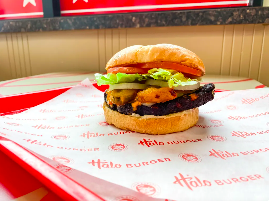 The BeatsXBeers® burger can be ordered “Veggie Style” on a chipotle black bean burger or “Classic Style” on a QP beef patty.