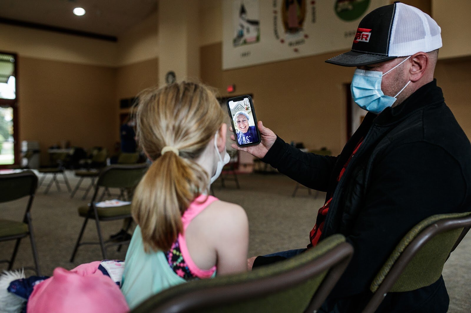 Marin Derwin (age 6) and her father Facetime her mother (a local registered nurse) to show her bandaid and proof of her first COVID-19 vaccination.