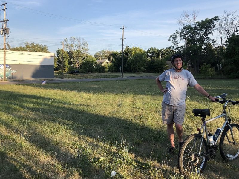 Dr. Thomas Henthorn, shown here giving a bike tour of Flint's neighborhood history, was a recipient of a Michigan Humanities award.