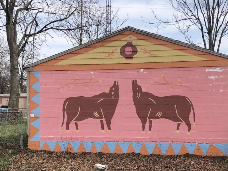 A Flint Public Art Project mural overlooks a community garden in the Eastside Franklin Park neighborhood.