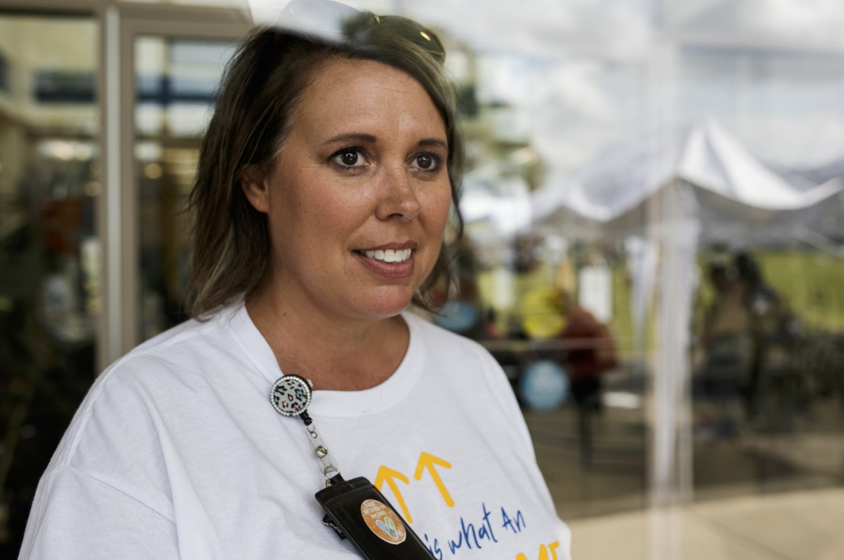 Stacy Sawyer, director of communications and marketing for Hamilton Community Health Network, looks over the Family Fun Day at the main clinic on Saginaw Street for National Health Center week.