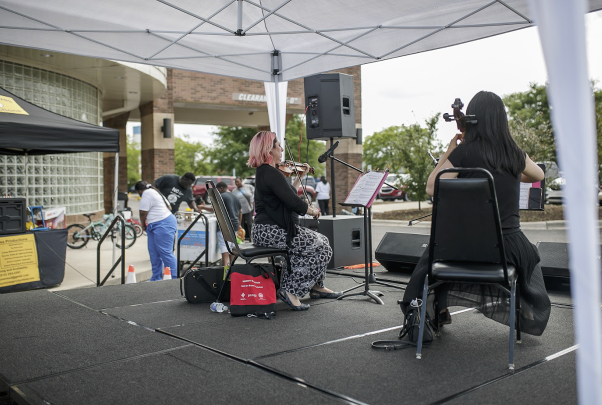 Another unique partnership for the event was with the Flint Institute of Music. A FIM cellist and violinist provided live music for the attendants at the Hamilton Clinic Network's Family Fun Day.