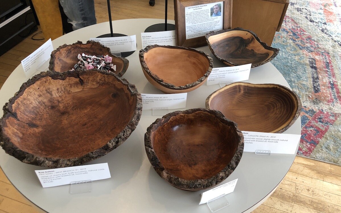 The gallery features custom jewelry by McAdow and work by other artists, like these wood-turned bowls by Flint artist Russ Dotson.