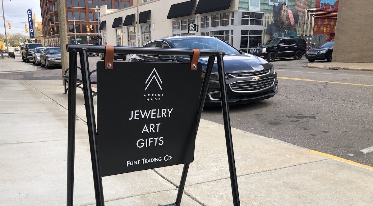 New street-level signage and a permanent sign on the building have helped bring more street traffic into Flint Trading Co.