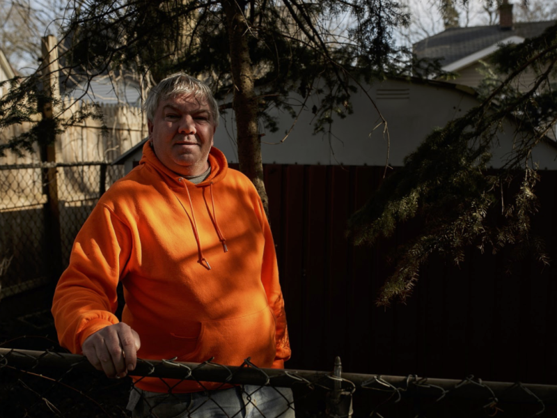 Kenneth D. Elder,  a resident of Eastside Franklin Park, stands in his backyard overlooking a yard behind his home that was cleaned up on May 15.