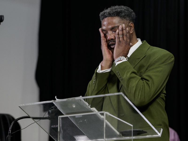 Elder L. Veotis Jones gives the sermon through a live broadcast of New Jerusalem's Sunday morning service.