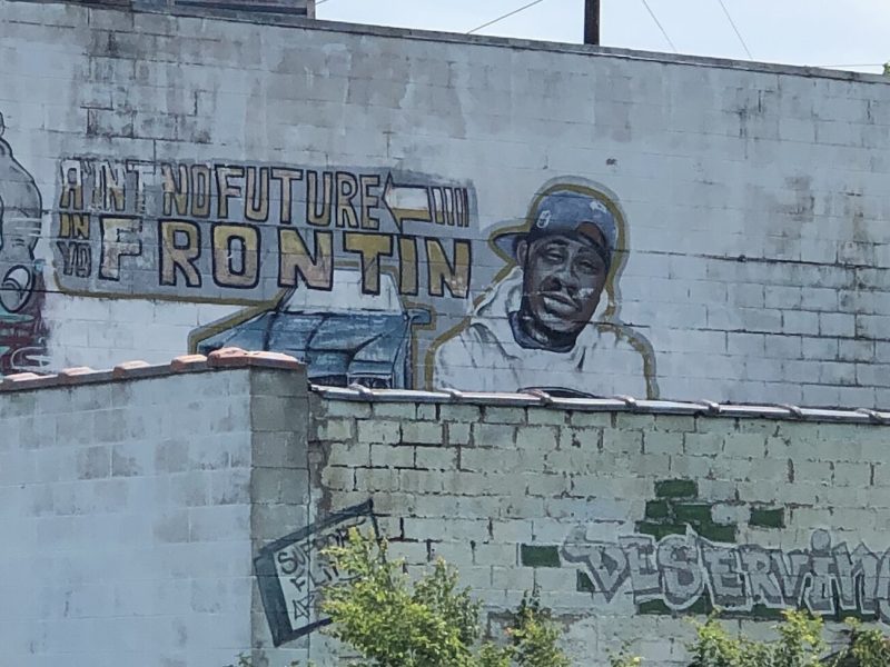 A mural honoring MC Breed is located near Fox Street and Glenwood Avenue in Flint.