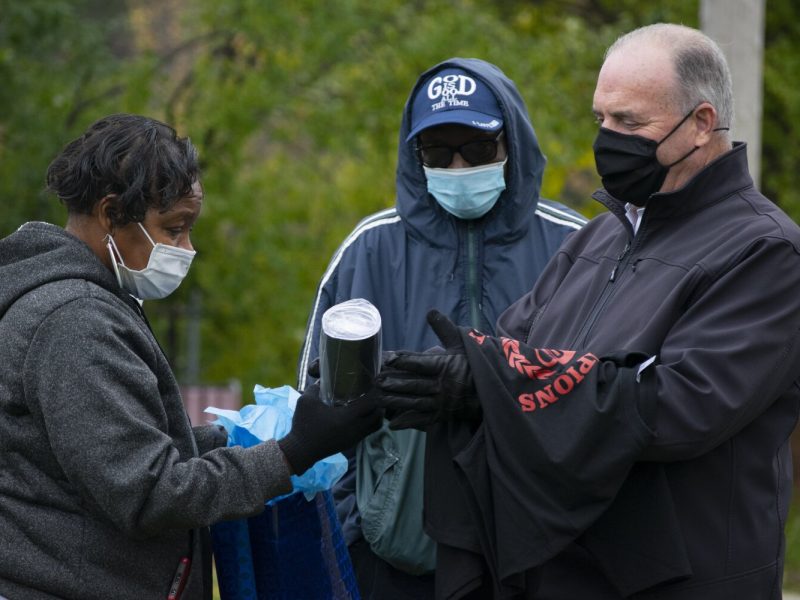 Kildee receives a 'Champions of Exellence' branded t-shirt and tumbler from BHNA President Jeanette Edwards.