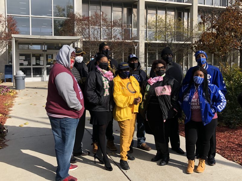 Organizers of a #walkthevote parade in Flint in front of City Hall on November 1.