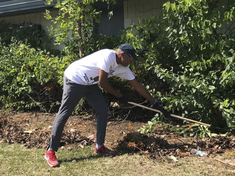 Resident Antoine Little working during a cleanup in the Sarvis Park area in Flint.