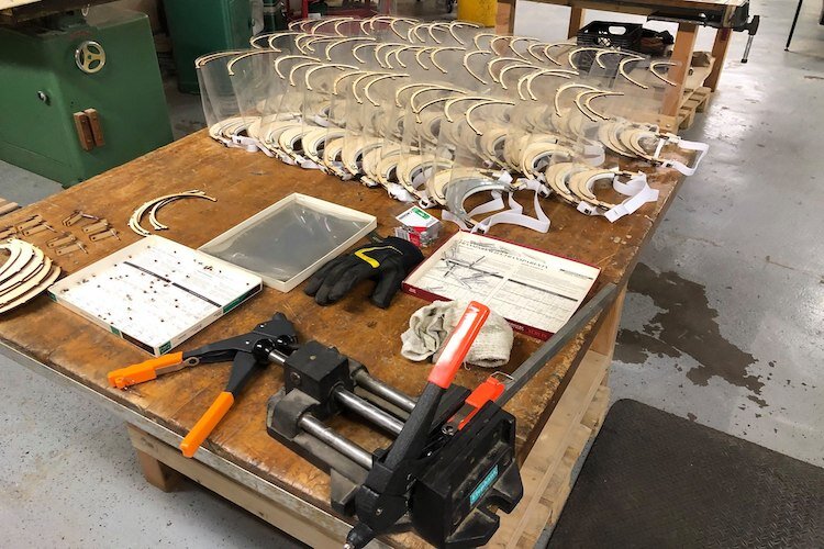 55 face shields freshly minted at Factory Two.