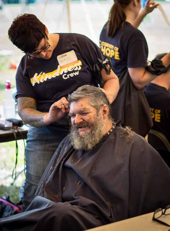 Earl Wayne Jones of Flint gets a haircut from Tarry Planer, a cosmetologist from Midland at the Convoy of Hope event in 2017. Jones said he couldn't remember the last time he had a haircut.