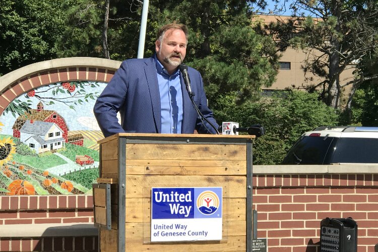 Jamie Gaskin, CEO of the United Way of Genesee and Shiawassee Counties, talks about the collective impact of donors at the 2019 campaign kickoff Aug. 22 at the Flint Farmers' Market.