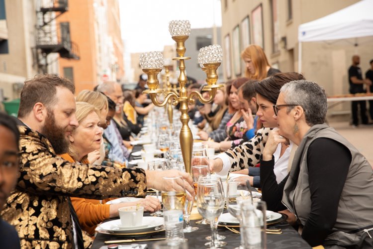 The dinner included a formal place setting, gold candelabras, craft beers, and a variety of wines.