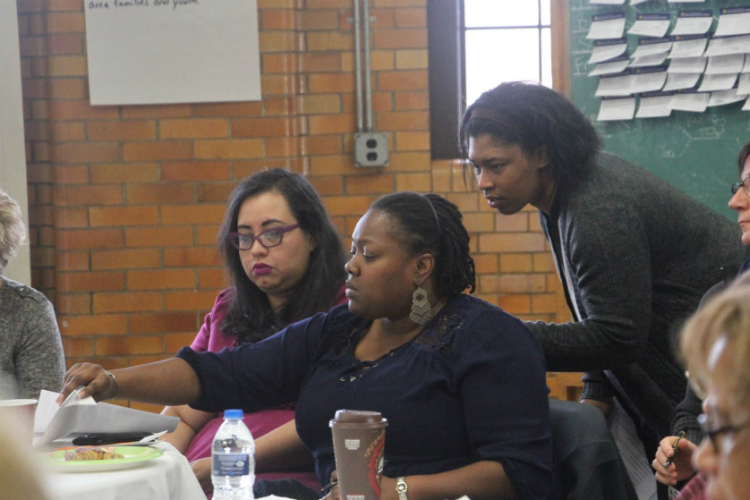 Vicki Johnson-Lawrence, standing at right) serves as program director of Flint ReCast, which will host its 3rd annual Resiliency and Environmental Justice Summit on March 28.