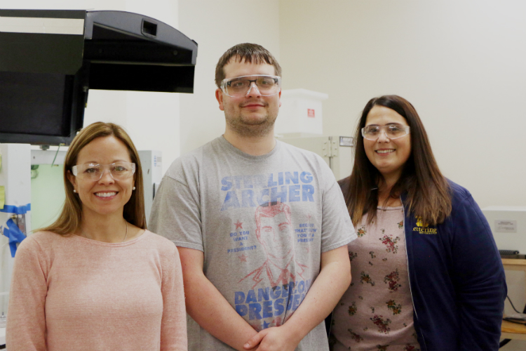 (Left to right) Chemical engineering faculty Mary Gilliam, student Graham Garner, and faculty Susan Farhat worked along with another student, Michael Magyar to develop a process that changes the surface of nanoparticles.