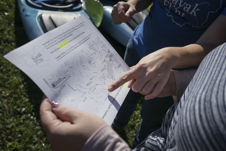Sarah Scheitler, Corridor Alliance manager, reviews the 1.5 mile kayaking route.