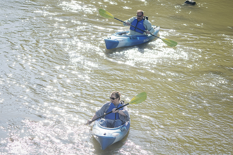 Kayak Flint caters to all levels of kayakers, including beginners like Tammy Walsh (front) who took the trip in September with her husband Mike.