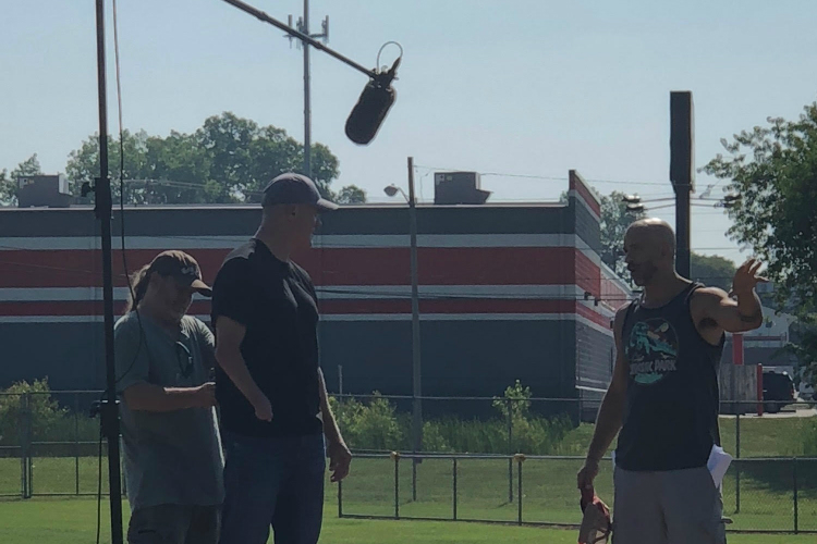MIke Ramsdell (far right) talks with famed pitcher Jim Abbott during filming at Whaley Park for a new documentary.