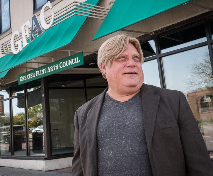 Greg Fiedler, president and CEO of the Greater Flint Arts Council, outside the GFAC gallery and offices on South Saginaw Street in Flint.