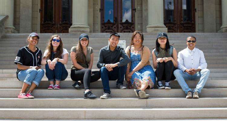 The Diplomat Fellowship participants pose for a photo on one of their many learning excursions. Here they are on the stairs of the state Capitol.