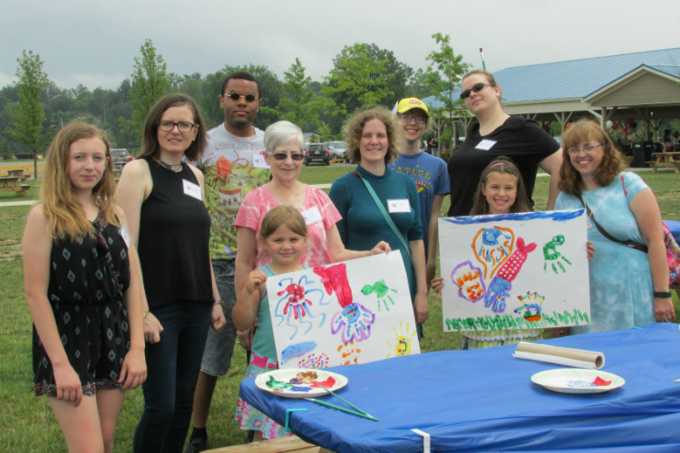 Young-arAnna Schuller, a master's student at UM-Flint, (fourth from left in pink) created Young Artistic Minds as a nonprofit dedicated to getting arts education back in public schools. tistic-minds-1