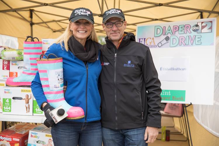 Flint businessman Phil Shaltz and ABC 12 anchor Angie Hendershot founded The Flint Diaper Bank four years ago and expect to distribute 1.2 million this year.