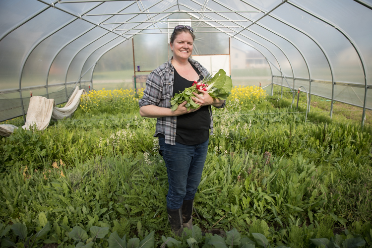 Erin Caudell shows off the radishes that could be yours in a convenient, new, healthy foods home delivery service launching in Flint. Not a fan of radishes? Don't worry. You can choose your own favorite foods.