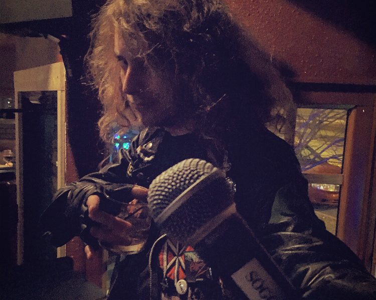 Seth Addison, poses on the stage after Comedy Night at Soggy Bottom Bar, in Flint. The usual roster includes 8 comics from the surrounding area every third Monday of the month.