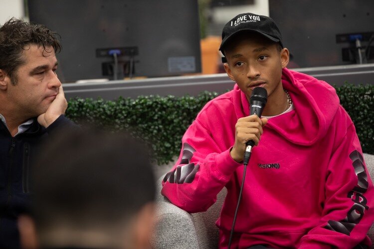 Celebrity Jaden Smith answers resident questions beside his co-founder of 501cThree Drew FitzGerald during a public showing of the Water Box on Monday, Dec. 2.
