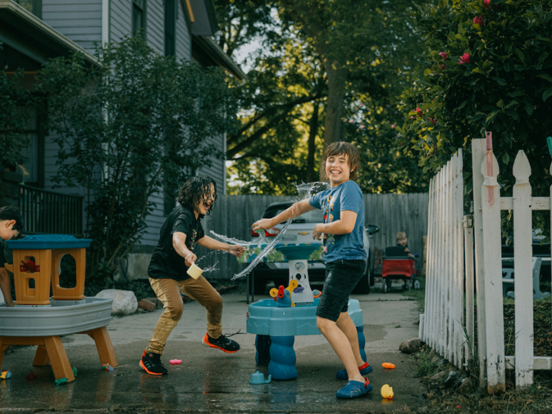 Kids and families enjoy a sunny evening at Porch Fest on July 18, 2025.